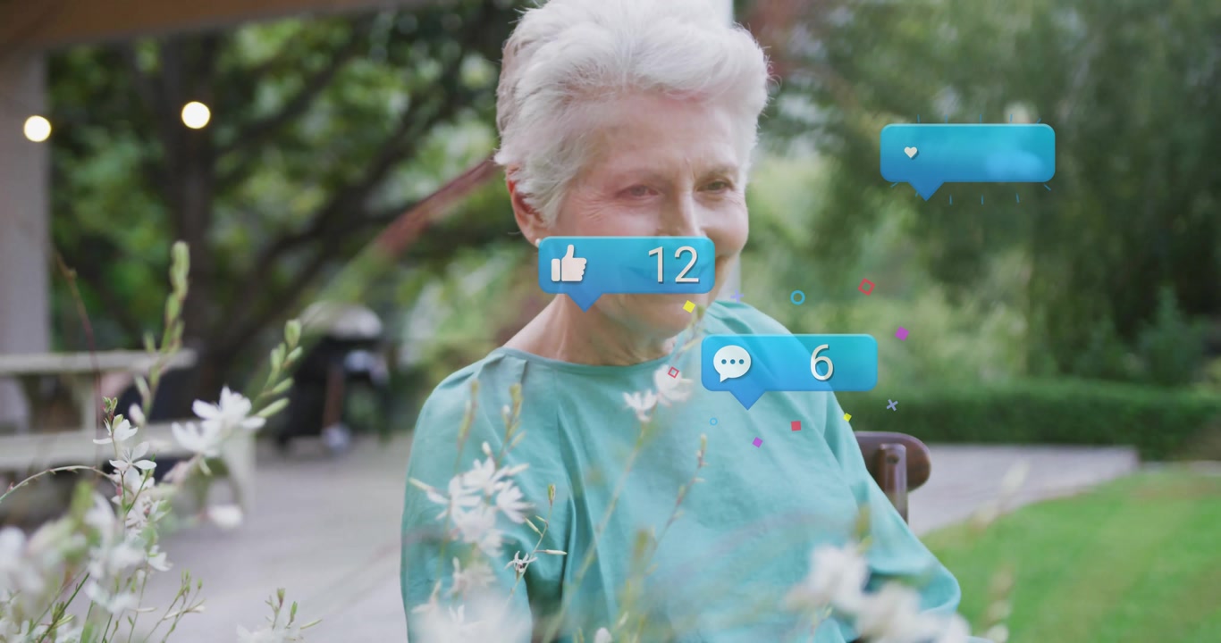 Senior woman smiling gazing forward causing social media reaction bubbles updating reaction counts