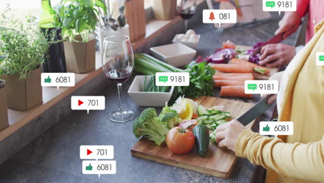Social media notifications animation over person preparing vegetables in kitchen