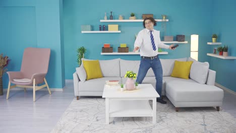 Fun-video-of-a-business-person-looking-at-the-phone-and-dancing-at-home.