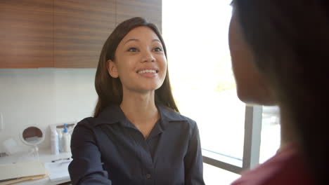 Doctor-In-Consultation-With-Female-Patient-In-Office