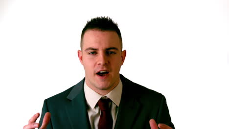 businessman shouting at the camera on white background