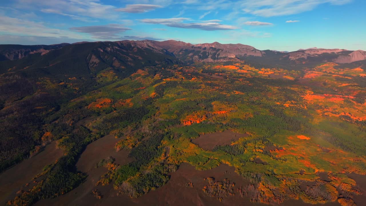 Crested Butte Ohio Swampy Kebler Pass Colorado aerial drone The Castle Mountain Mill rock Castle Gunnison National Forest morning autumn fall Aspen tree colors blue sky clouds forward pan up motion