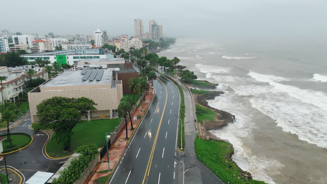 Wet Coastal Road With Powerful Sea Waves During Tropical Storm Melissa In Santo Domingo, Dominican Republic. aerial shot