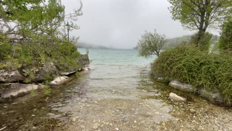 view on foggy fuschlsee in salzkammergut, austria