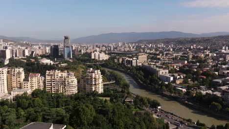 aerial boom shot above tbilisi, georgia on summer day