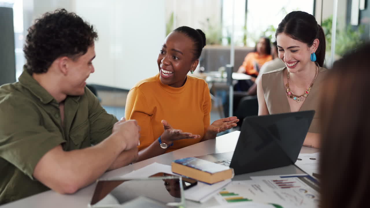 Diverse Business Team High-Fiving During a Successful Office Meeting