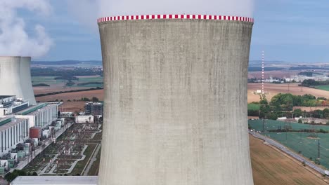 aerial descend near of dukovany nuclear power plant cooling tower wall