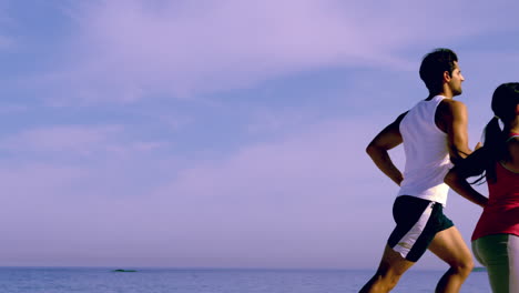 Young-couple-running-together