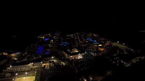 aerial view away from illuminated hotels on the coast of rhodes, night in greece