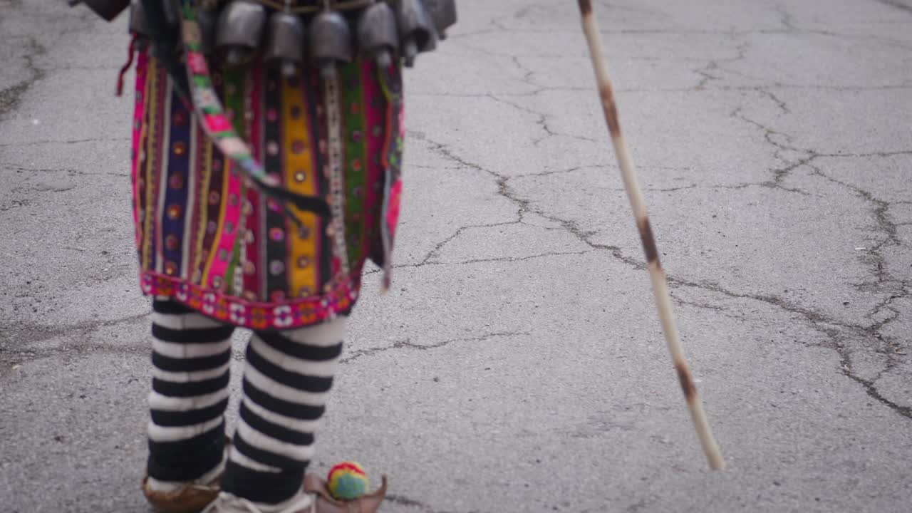 Traditional folklore shoes with pom-poms worn by jumping Balkan dancer
