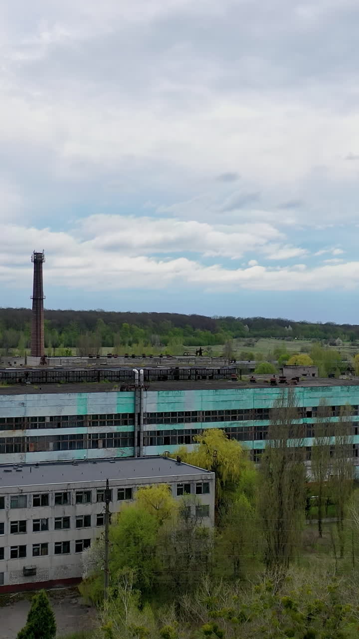 Aero view of ruined city full of disaster. Abandoned houses in ruined city. Vertical video