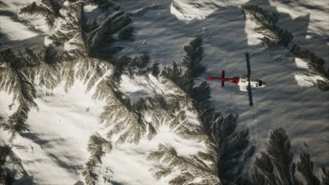 helicopter-above-mountains-in-snow