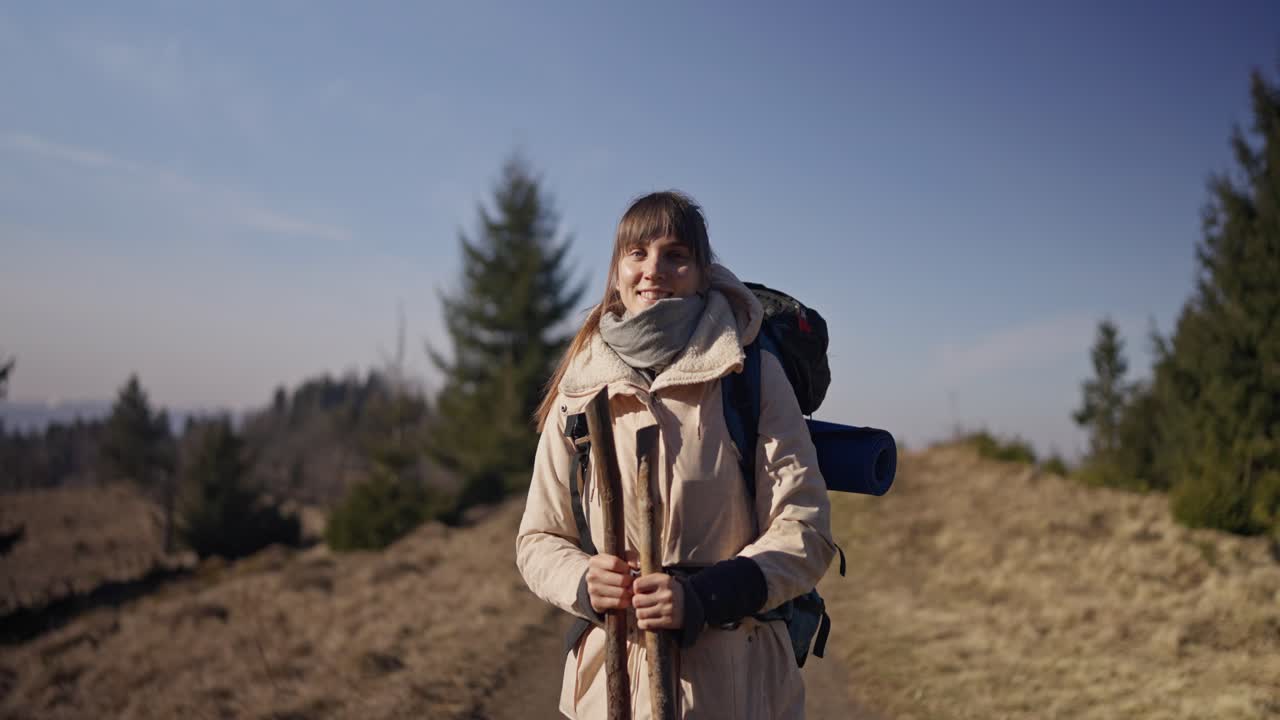 Woman hiking in the mountains with a backpack