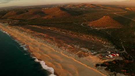 Establishing-shot-of-a-beautiful-beach-hotel-at-sunset