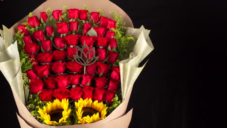 roses bouquet and sunflowers arrangement slider shot black background