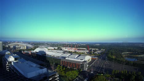 sydney olympic park timelapse at sunrise as the shadows shorten over the buildings