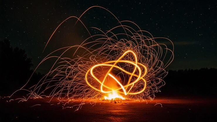 Mesmerizing Display of Spiraling Sparks and Glowing Embers in a Night Sky, Capturing the Dynamic Movement of Fire and Light in Enchanting Patterns