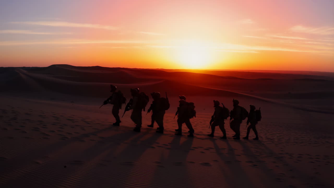 Military Personnel on Desert Exercise at Sunset