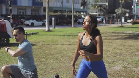 man showing exercise technique in park