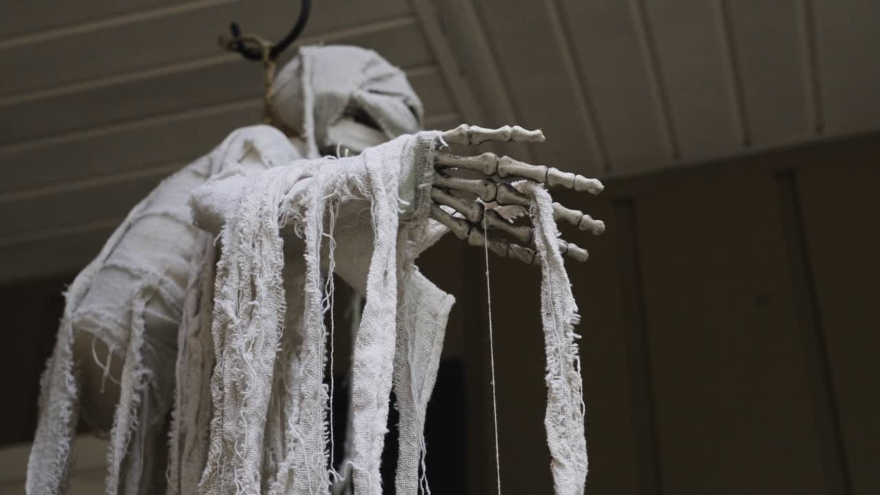 A spooky Ghoul decoration with fabric strips shown in close up