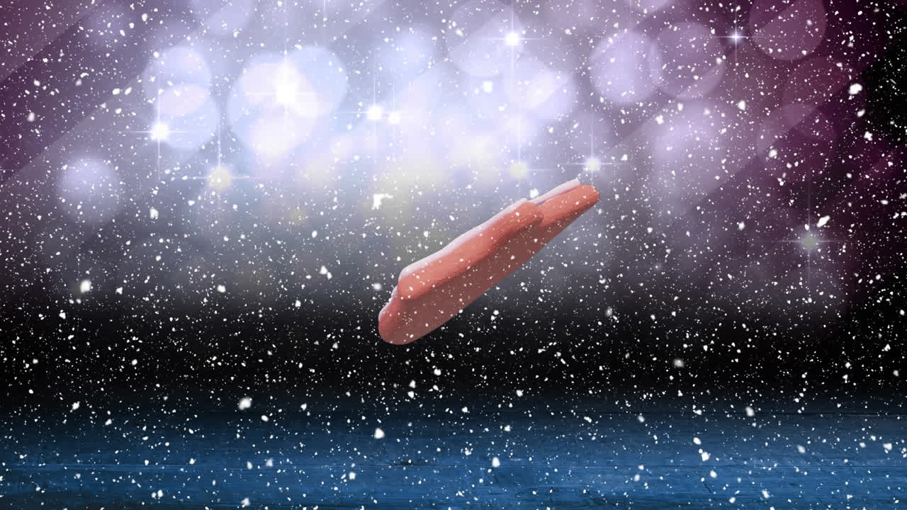 크리스마스 벨 진저브레드 쿠키의 애니메이션 눈이 떨어지고 보케 조명.