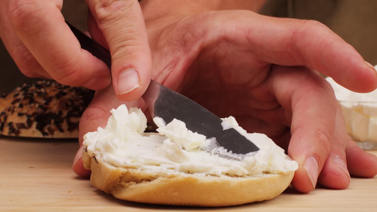 Bagel sandwich brunch, lunch plate of a bagel with smoked salmon and cream cheese and ham, close up morning cafe menu.