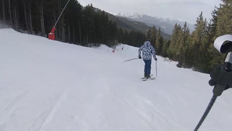 Skiing-on-piste-through-pine-trees-in-the-French-Alps