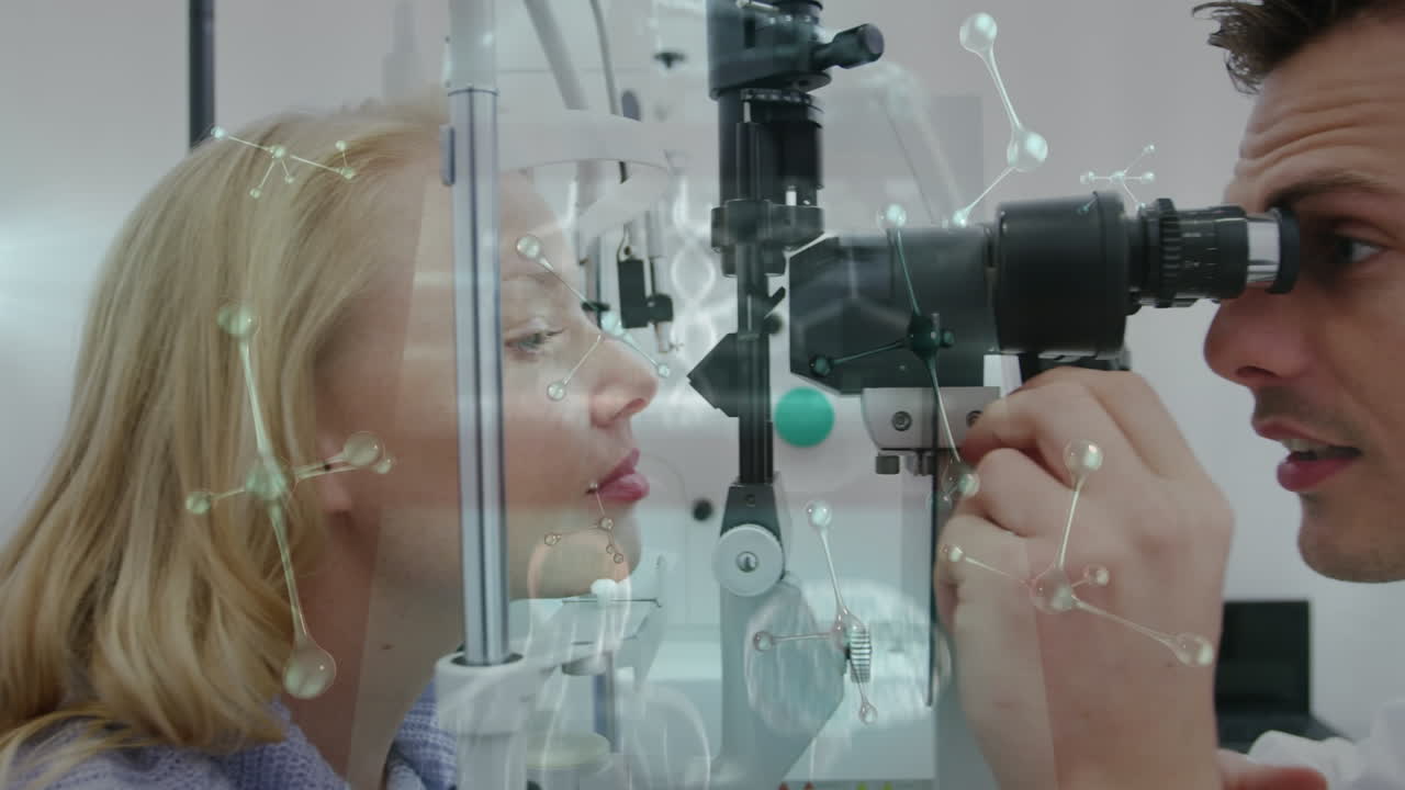 Animation of molecules and screens over caucasian male eye doctor and female patient