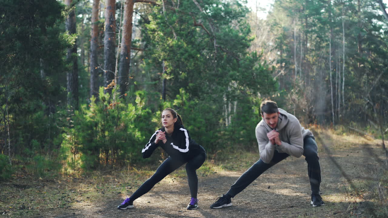 Couple Exercising in the Forest