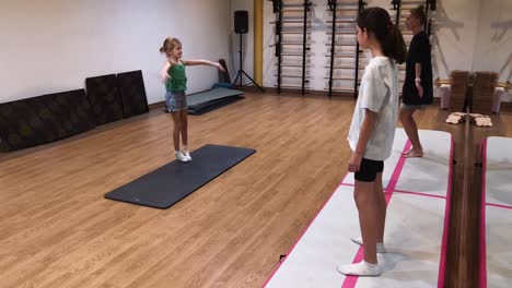 girls practicing gymnastics