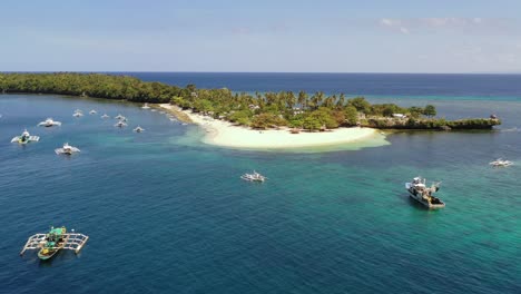 paradisiac tropical beach and traditional bangka boats, philippines