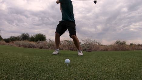 A-golfer-makes-contact-with-the-ball-with-his-drive,-Scottsdale,-Arizona