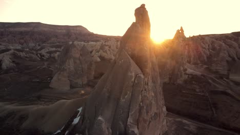 Sunrise-in-Cappadocia-red-valley-of-fairy-chimneys-,-Aerial-drone-flight