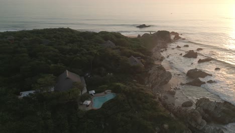 aerial at sunset of la punta zicatela beach in puerto escondido oaxaca mexico