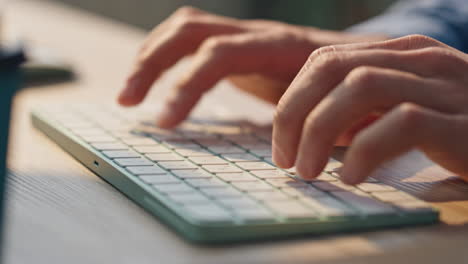 man fingers texting keyboard working computer closeup. freelancer hands typing