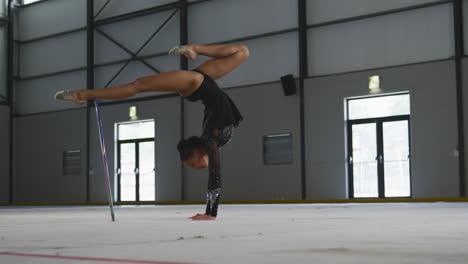 female gymnast performing at sports hall