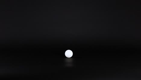 a ping pong ball rolls across a surface