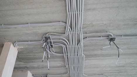 electrical installation of plastic electrification tubes on building site