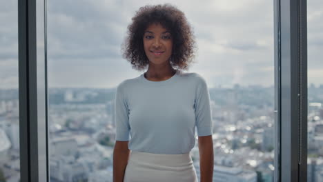 smiling business woman looking at camera