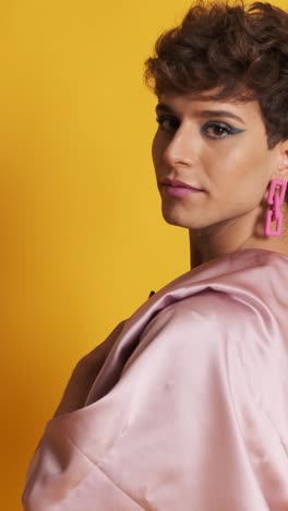 transgender man with sensual fashion clothes posing in a photographic studio