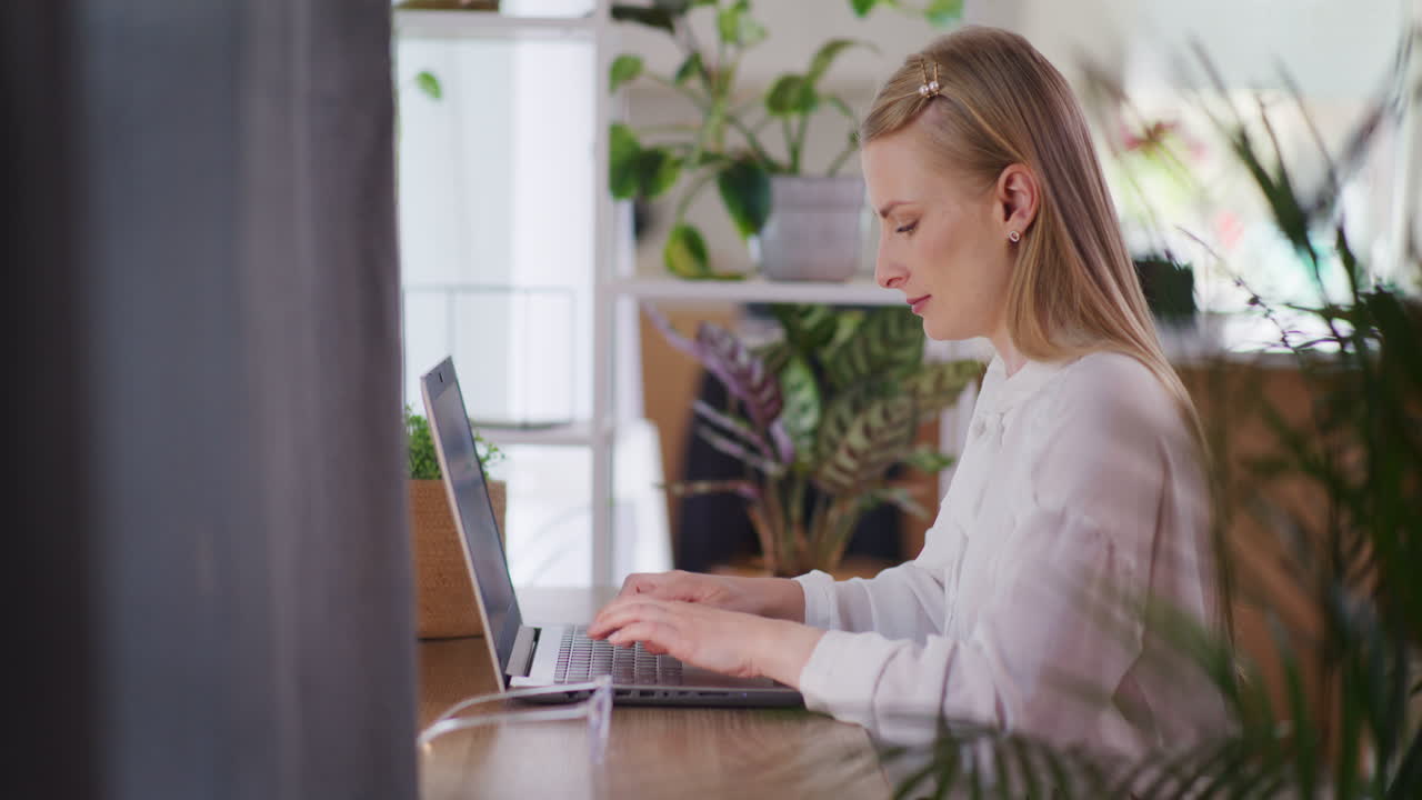 Woman Writing E-Mail on Laptop