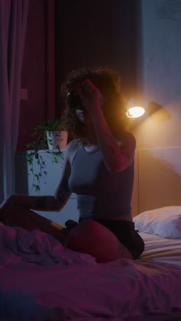 woman wearing vr headset in bedroom