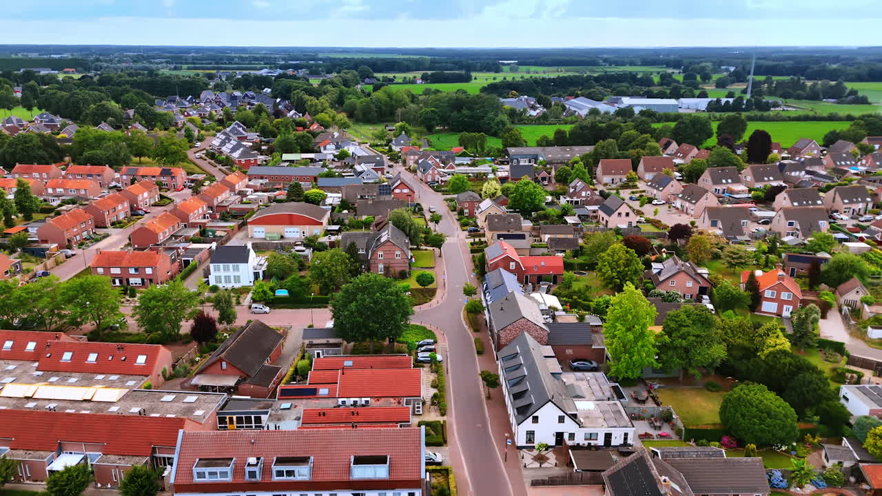 Cute houses in the cozy town surrounded by lush greenery. Aerial perspective on Vierlingsbeek, Netherlands