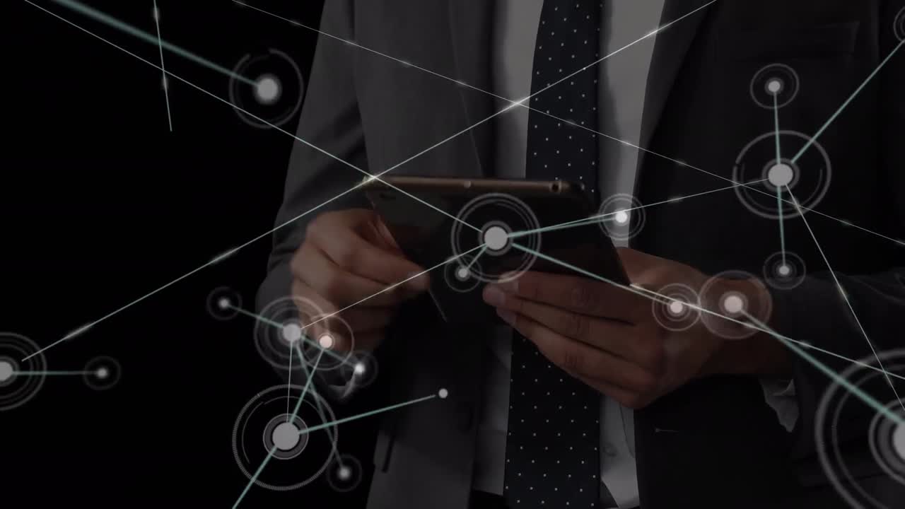 Animation of networks of connections over caucasian businessman using tablet