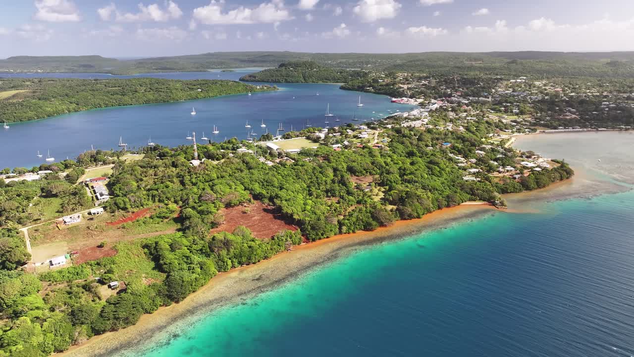 Amazing view of tropical island Vava'u in Tonga. Colourful water, tropical forest and Neiafu city.