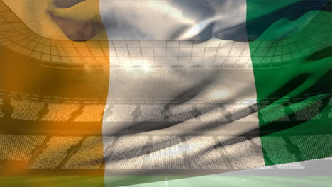 ivorian flag against soccer stadium
