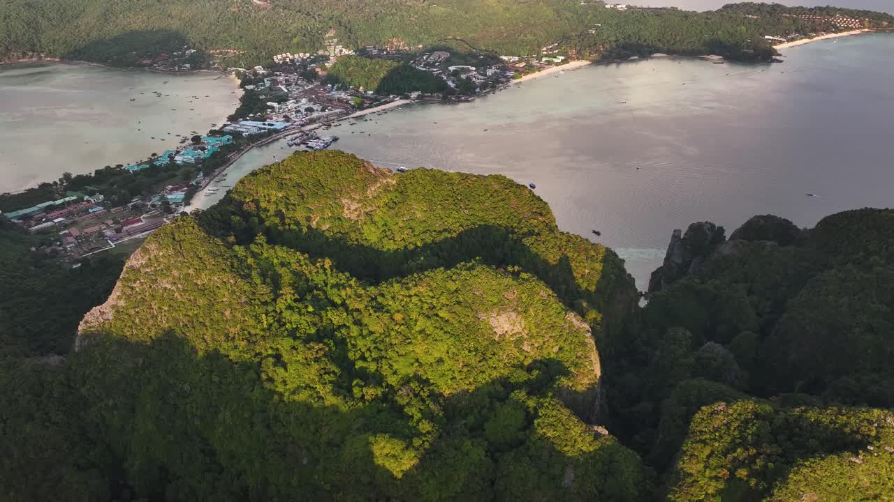Scenic drone reveal over dramatic mountain in Koh Phi Phi Don to view paradise island, holiday.