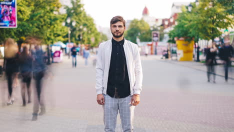 man standing on a city street