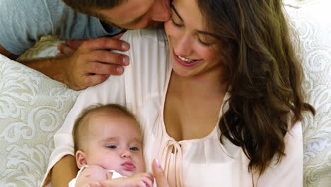 Happy-parents-with-their-baby