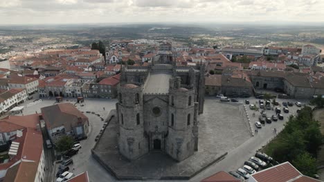 aerial pullback from old cathedral revealing beautiful guarda cityscape, portugal